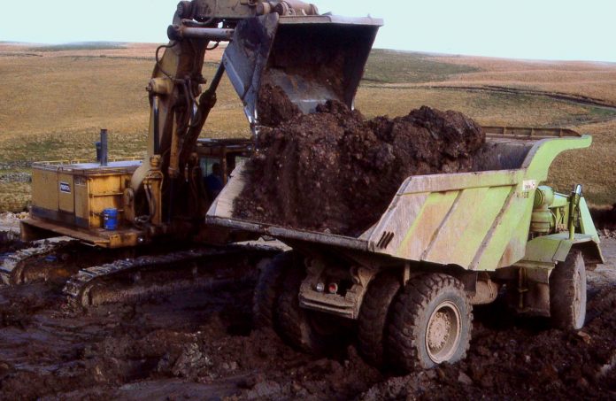 Mechanical digger and dumper truck working on the M74 project excavation