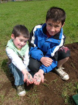 Luke and Conner proudly show their discoveries.