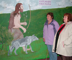 Visitors viewing the illustrated panels