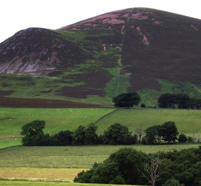 Tinto Hill as viewed from Lamington. Note the pink rock in the main body of the hill (felsite) and the black rock (basalt) protruding from a later intrusion.